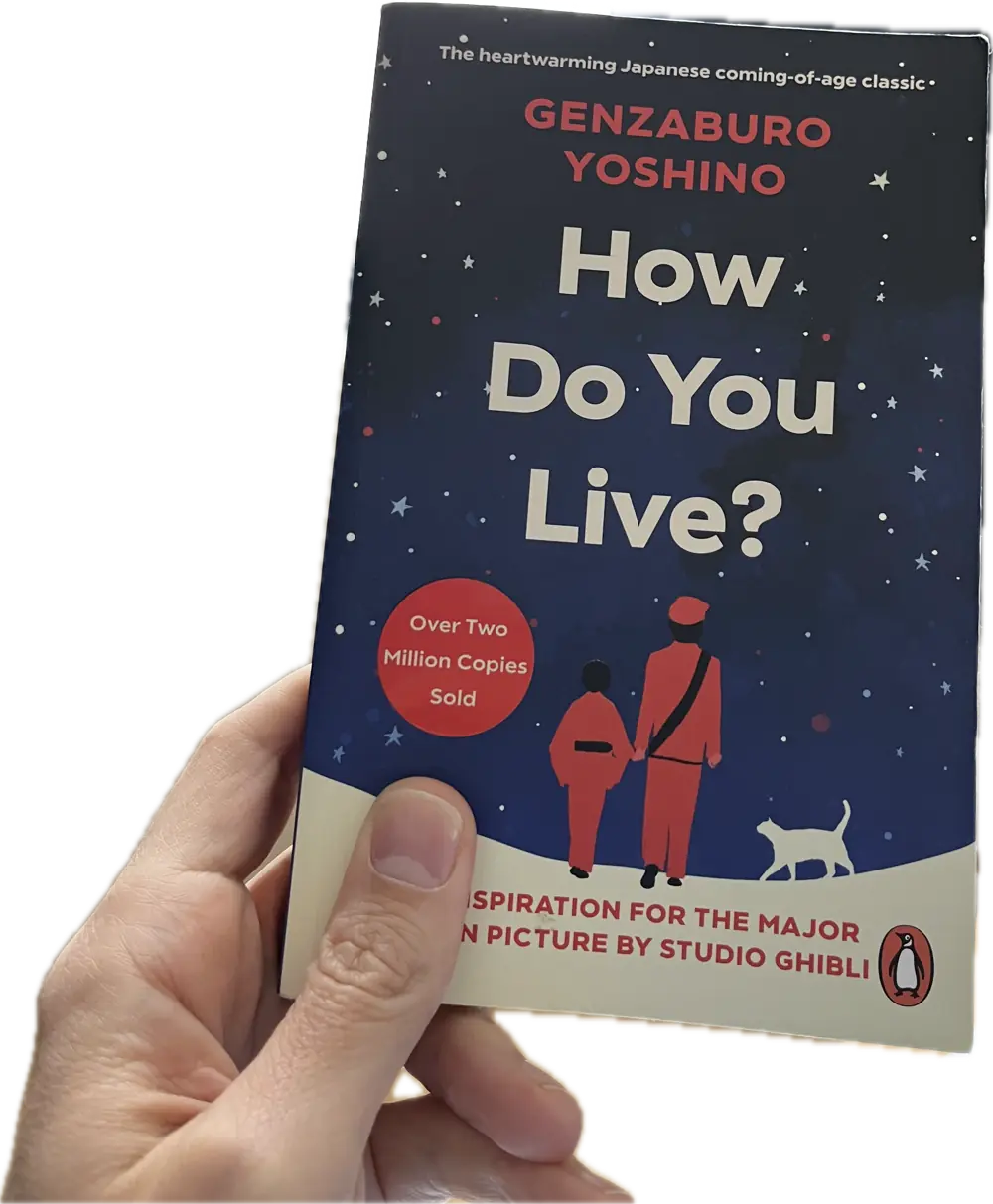 A hand holding a book, How Do You Live?