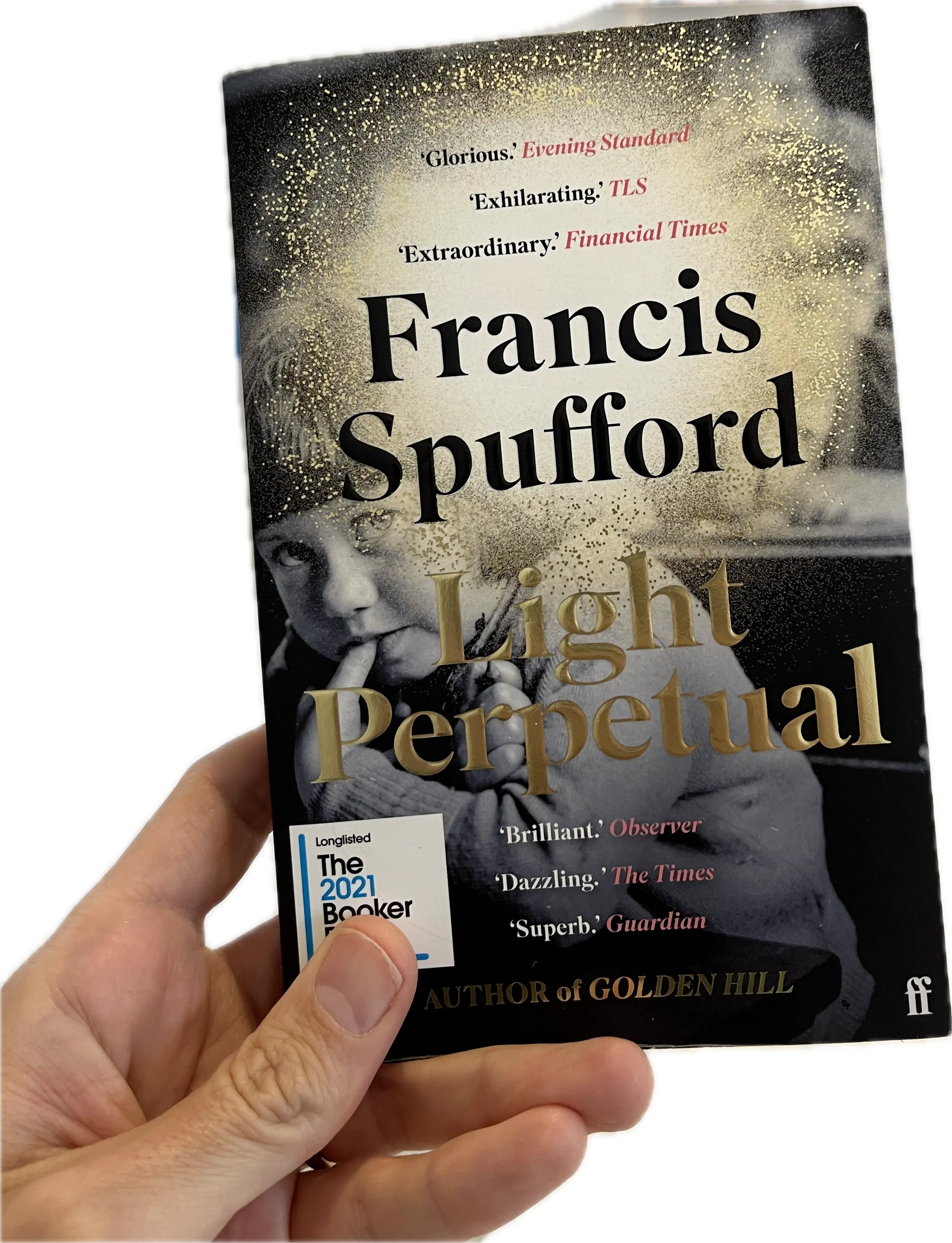 A hand holding a book, Light Perpetual