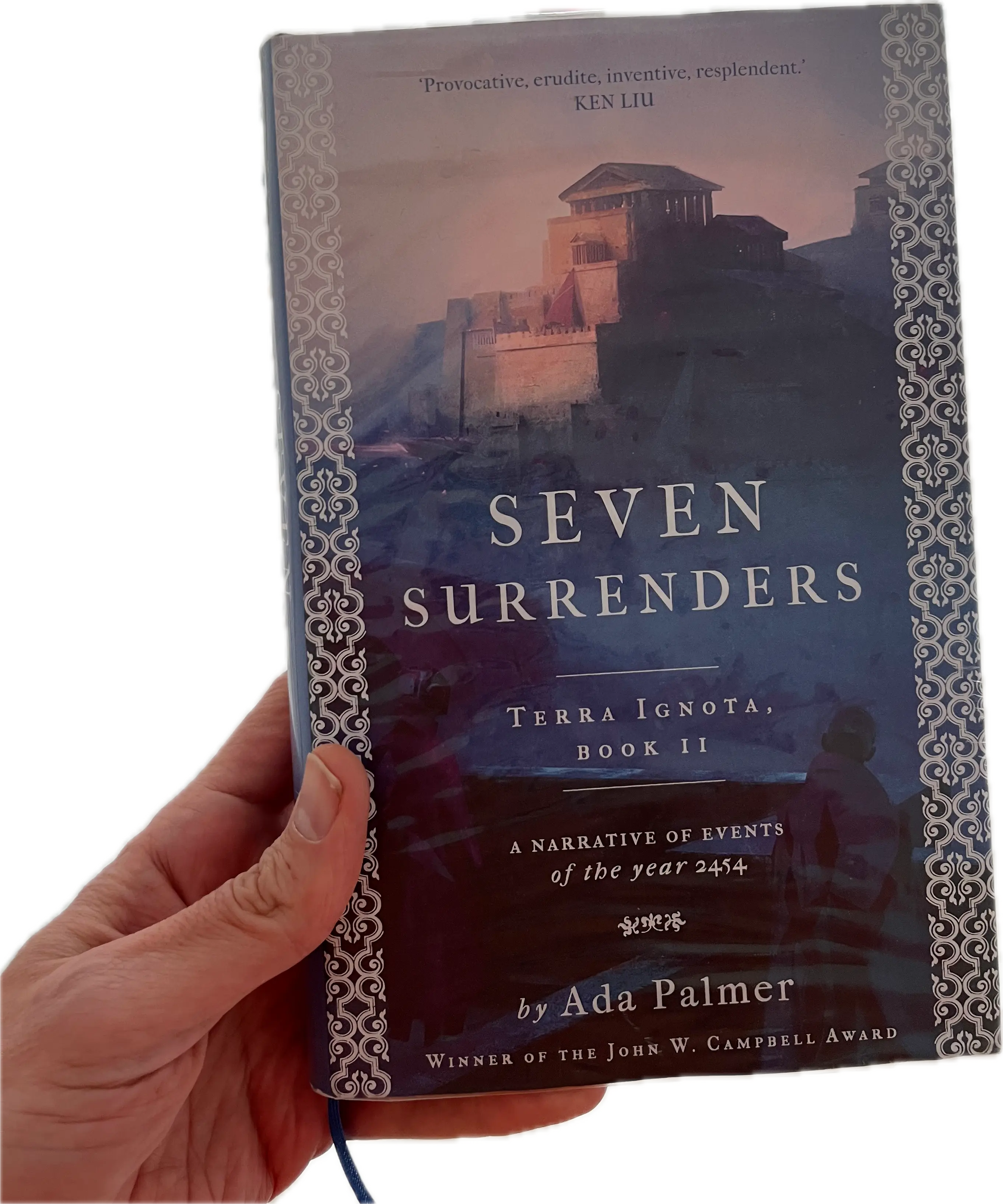 A hand holding a book, Seven Surrenders