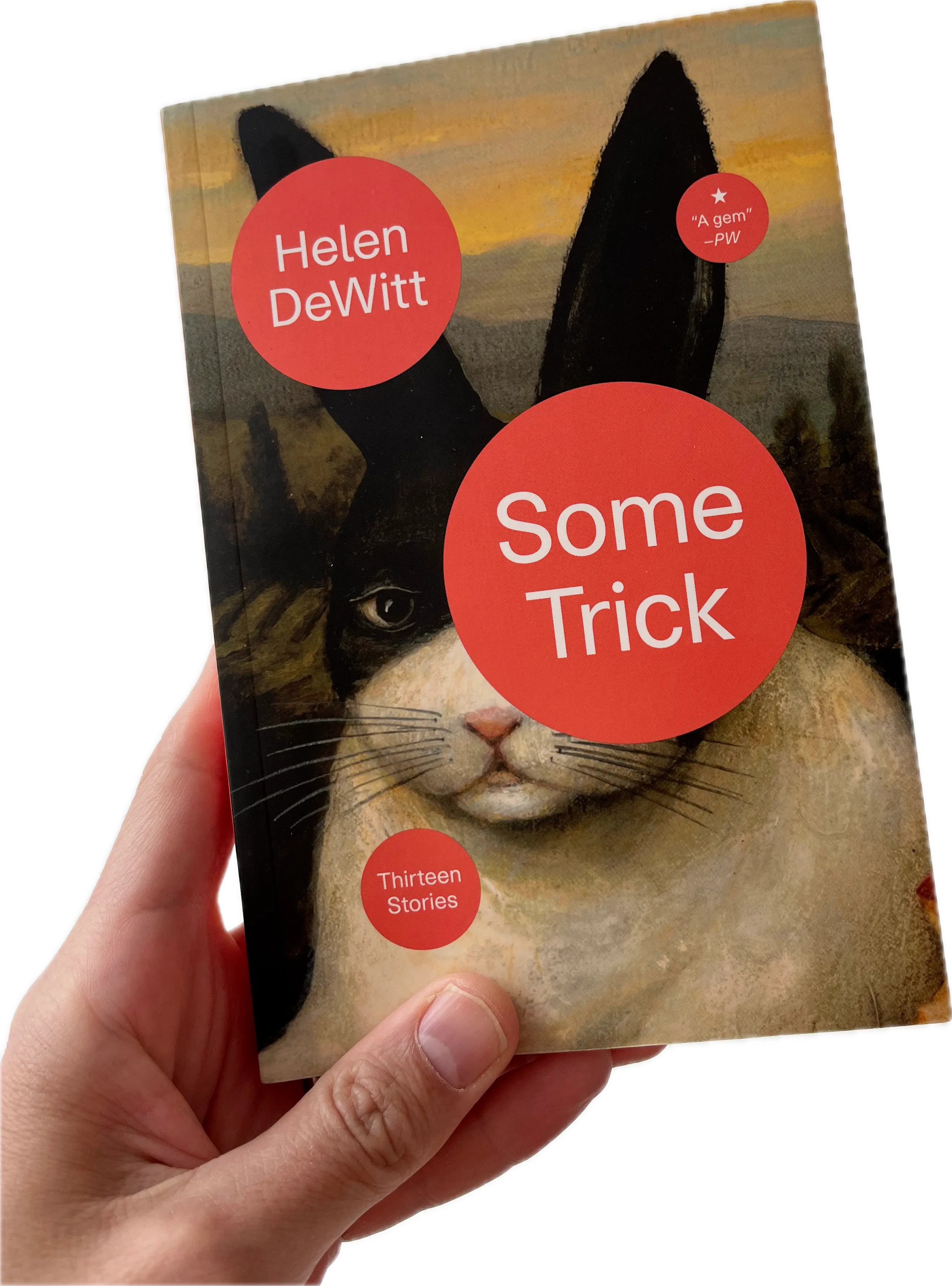 A hand holding a book, Some Trick