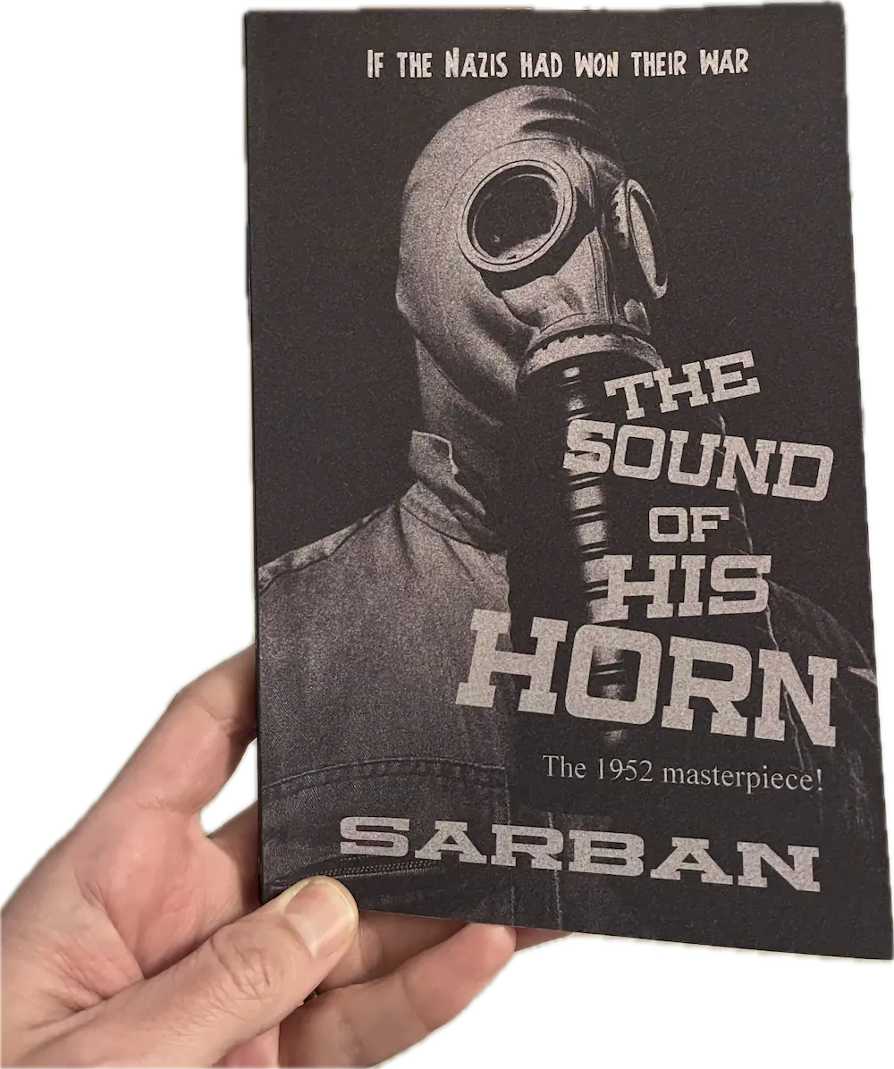 A hand holding a book, The Sound Of His Horn